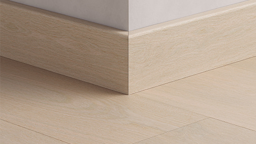 close up of a grey hardwood skirting from pergo